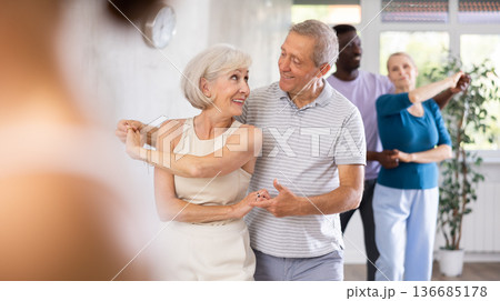Group of multiethnic mature people dancing social dance 136685178