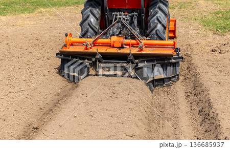 Farm tractor with agriculture soil bed former ridger. Farm tractor with agriculture soil bed former ridger. 136685937