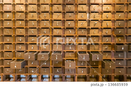 Traditional chinese pharmacy shop. Ancient herbs pharmacy cabinet wooden drawers in background Traditional chinese pharmacy shop. Ancient herbs pharmacy cabinet wooden drawers in background 136685939