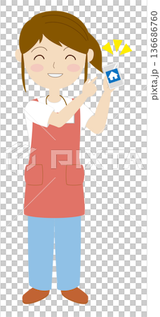 A woman wearing an apron navigating a website on her smartphone 136686760
