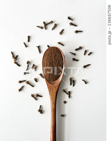 Ground Cloves on Wooden Spoon Flat Lay Ground Cloves on Wooden Spoon Flat Lay 136687506