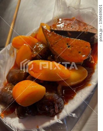 Spicy and chewy tteokbokki paired with rich and savory sundae, creating a classic Korean street food combination. A perfect balance of bold flavors and satisfying textures for an indulgent treat. 136689001