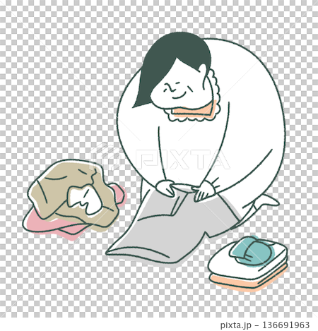 Elderly woman folding laundry Elderly woman folding laundry 136691963