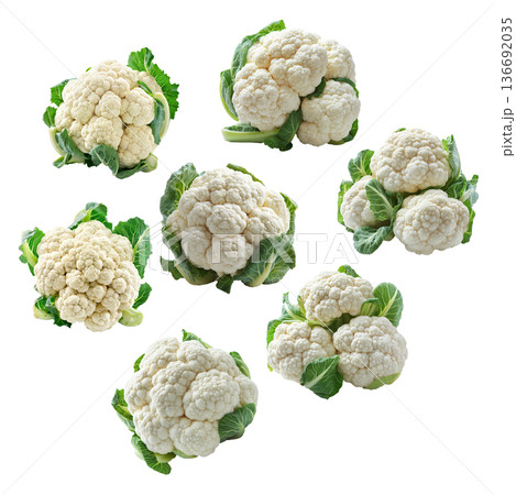 Multiple fresh cauliflower heads with green leaves isolated on a white background, concept of healthy organic vegetables 136692035