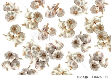 Multiple whole garlic bulbs arranged in a seamless pattern, isolated on white background. Concept of organic food and culinary spice Multiple whole garlic bulbs arranged in a seamless pattern, isolated on white background. Concept of organic food and culinary spice 136692049