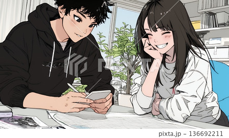 仲良く二人で旅行の計画を立てている若いカップル