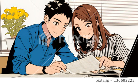 仲良く二人で旅行の計画を立てている若いカップル