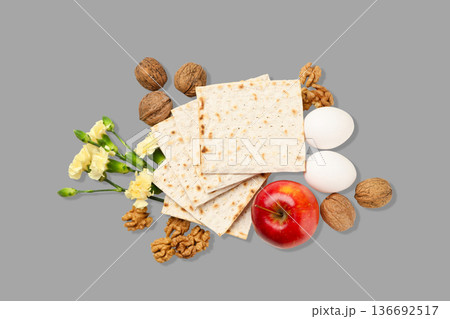 Passover items like matzah, eggs, and apples arranged Passover items like matzah, eggs, and apples arranged 136692517