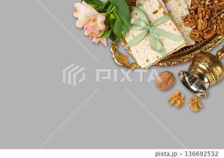 A platter holds matzah, walnuts, and flowers for Passover A platter holds matzah, walnuts, and flowers for Passover 136692532