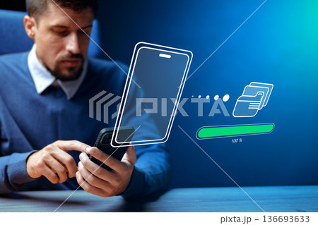Man uses smartphone to transfer files and data in a modern setting Man uses smartphone to transfer files and data in a modern setting 136693633