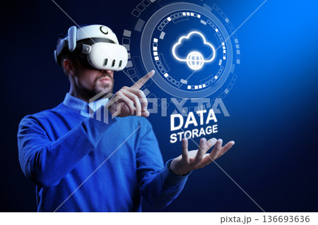 Person using virtual reality headset for data storage demonstration in a digital space Person using virtual reality headset for data storage demonstration in a digital space 136693636