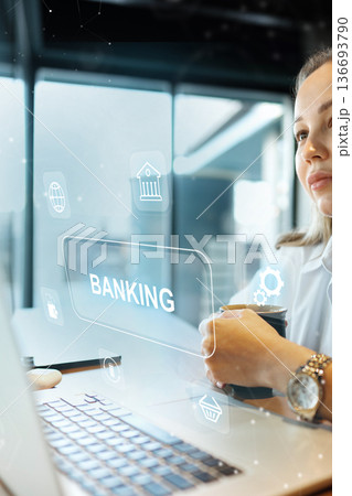 User reviews banking invoice payment while using a laptop in a modern workspace User reviews banking invoice payment while using a laptop in a modern workspace 136693790