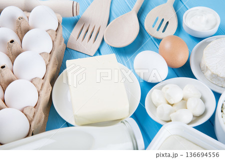 dairy products on blue wooden background, top view dairy products on blue wooden background, top view 136694556