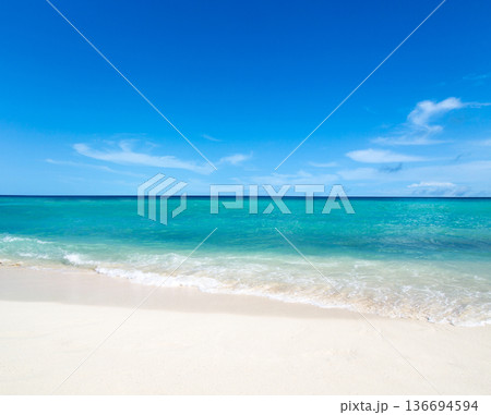 Beautiful beach. Tropical beach. Holiday and vacation concept. Sand, blue sea water, turquoise ocean, sun sky white clouds Beautiful beach. Tropical beach. Holiday and vacation concept. Sand, blue sea water, turquoise ocean, sun sky white clouds 136694594