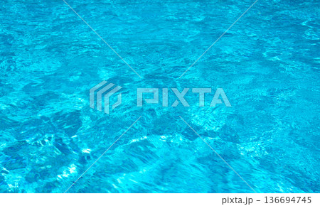 Blue pool water with sun reflections Blue pool water with sun reflections 136694745