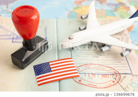 US America flag with passport and airplane for travel. US America flag with passport and airplane for travel. 136699676