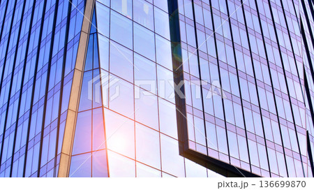 Modern sustainable glass office buildings. Exterior view of corporate headquarters glass buildings architecture.Glass windows in energy-efficient buildings. Financial business center buildings. Modern sustainable glass office buildings. Exterior view of corporate headquarters glass buildings architecture.Glass windows in energy-efficient buildings. Financial business center buildings. 136699870