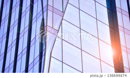 Modern sustainable glass office buildings. Exterior view of corporate headquarters glass buildings architecture.Glass windows in energy-efficient buildings. Financial business center buildings. Modern sustainable glass office buildings. Exterior view of corporate headquarters glass buildings architecture.Glass windows in energy-efficient buildings. Financial business center buildings. 136699874