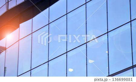 Modern sustainable glass office buildings. Exterior view of corporate headquarters glass buildings architecture.Glass windows in energy-efficient buildings. Financial business center buildings. Modern sustainable glass office buildings. Exterior view of corporate headquarters glass buildings architecture.Glass windows in energy-efficient buildings. Financial business center buildings. 136699881