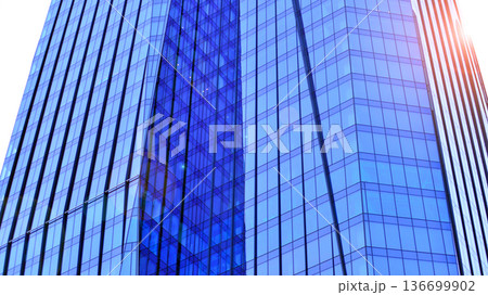 Modern sustainable glass office buildings. Exterior view of corporate headquarters glass buildings architecture.Glass windows in energy-efficient buildings. Financial business center buildings. Modern sustainable glass office buildings. Exterior view of corporate headquarters glass buildings architecture.Glass windows in energy-efficient buildings. Financial business center buildings. 136699902