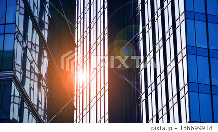 Modern sustainable glass office buildings. Exterior view of corporate headquarters glass buildings architecture.Glass windows in energy-efficient buildings. Financial business center buildings.  136699918