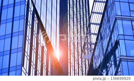 Modern sustainable glass office buildings. Exterior view of corporate headquarters glass buildings architecture.Glass windows in energy-efficient buildings. Financial business center buildings.  136699920