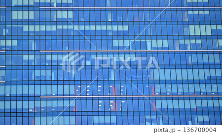 Exterior view of corporate headquarters glass buildings architecture. Modern sustainable glass office buildings. Glass windows in energy-efficient buildings. Financial business center buildings. Exterior view of corporate headquarters glass buildings architecture. Modern sustainable glass office buildings. Glass windows in energy-efficient buildings. Financial business center buildings. 136700004