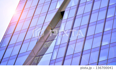 Exterior view of corporate headquarters glass buildings architecture. Modern sustainable glass office buildings. Glass windows in energy-efficient buildings. Financial business center buildings. Exterior view of corporate headquarters glass buildings architecture. Modern sustainable glass office buildings. Glass windows in energy-efficient buildings. Financial business center buildings. 136700041