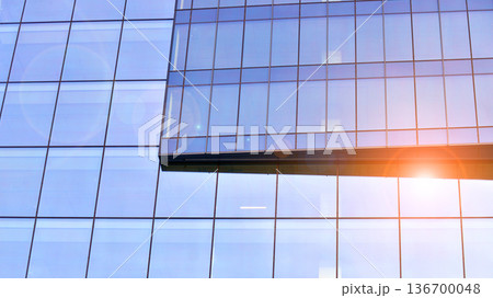 Exterior view of corporate headquarters glass buildings architecture. Modern sustainable glass office buildings. Glass windows in energy-efficient buildings. Financial business center buildings. Exterior view of corporate headquarters glass buildings architecture. Modern sustainable glass office buildings. Glass windows in energy-efficient buildings. Financial business center buildings. 136700048