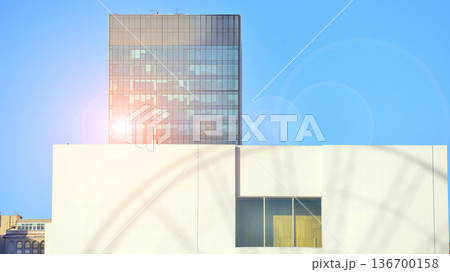 Exterior view of corporate headquarters glass buildings architecture. Modern sustainable glass office buildings. Glass windows in energy-efficient buildings. Financial business center buildings. Exterior view of corporate headquarters glass buildings architecture. Modern sustainable glass office buildings. Glass windows in energy-efficient buildings. Financial business center buildings. 136700158