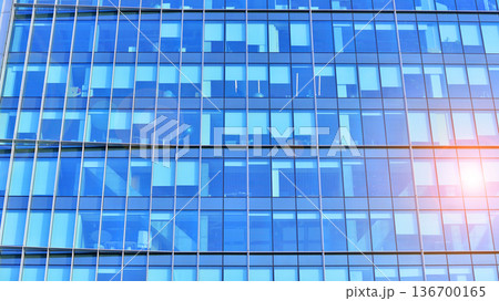 Exterior view of corporate headquarters glass buildings architecture. Modern sustainable glass office buildings. Glass windows in energy-efficient buildings. Financial business center buildings. Exterior view of corporate headquarters glass buildings architecture. Modern sustainable glass office buildings. Glass windows in energy-efficient buildings. Financial business center buildings. 136700165