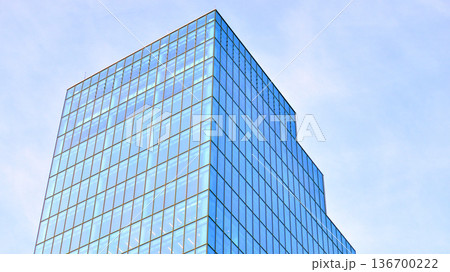 Exterior view of corporate headquarters glass buildings architecture. Modern sustainable glass office buildings. Glass windows in energy-efficient buildings. Financial business center buildings. Exterior view of corporate headquarters glass buildings architecture. Modern sustainable glass office buildings. Glass windows in energy-efficient buildings. Financial business center buildings. 136700222