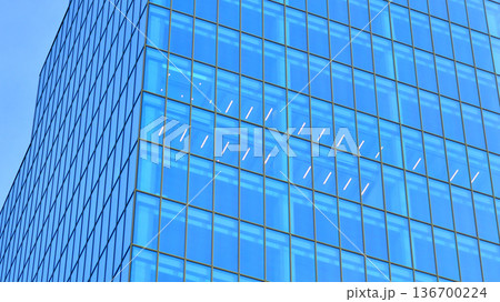 Exterior view of corporate headquarters glass buildings architecture. Modern sustainable glass office buildings. Glass windows in energy-efficient buildings. Financial business center buildings. Exterior view of corporate headquarters glass buildings architecture. Modern sustainable glass office buildings. Glass windows in energy-efficient buildings. Financial business center buildings. 136700224