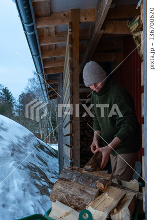 Rural Winter Lifestyle and Firewood Preparation. Rural Winter Lifestyle and Firewood Preparation. 136700620