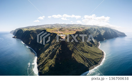 Wide drone view of Ponta do Pargo, Madeira Portugal, wave lines trace the base of sheer cliffs 136700638