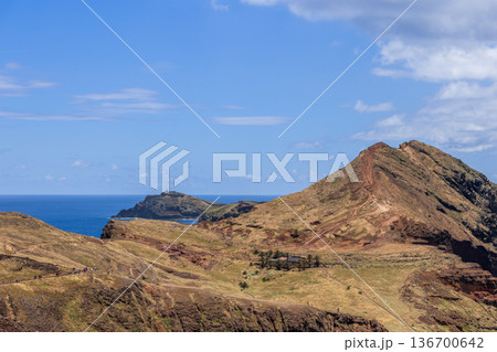 Arid ridges of Ponta de Sao Lourenco, Madeira, descend to Baia Abra and Farol lighthouse islet Arid ridges of Ponta de Sao Lourenco, Madeira, descend to Baia Abra and Farol lighthouse islet 136700642