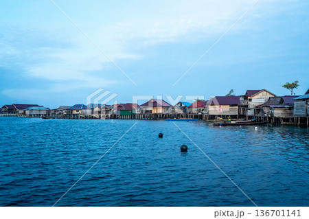 Fishermen houses at sunset, Pulau Papan, Malenge, Sulawesi, Indonesia 136701141