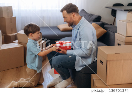 Father with son are in new home, with gifts 136701374