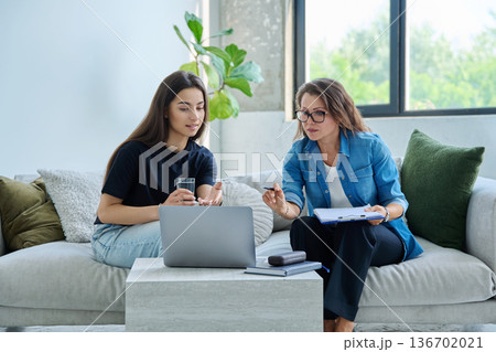 Teenage girl patient in therapy session with social mental therapist Teenage girl patient in therapy session with social mental therapist 136702021