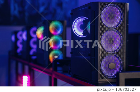 Gaming computer is in the dark room with neon lighting 136702527