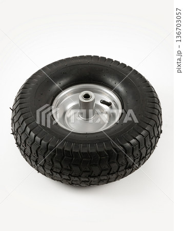 Wheel is pneumatic on a white background. Black rubber, grey disc. 136703057