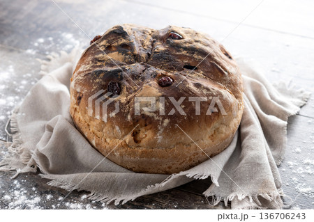 Traditional Irish soda bread with raisins, freshly baked Traditional Irish soda bread with raisins, freshly baked 136706243