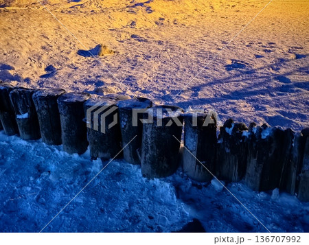 Wooden breakwaters in ice and snow in the Baltic Sea 136707992