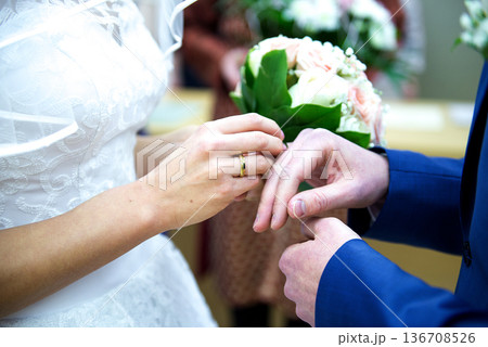 Exchanging Wedding Rings During Marriage Ceremony 136708526