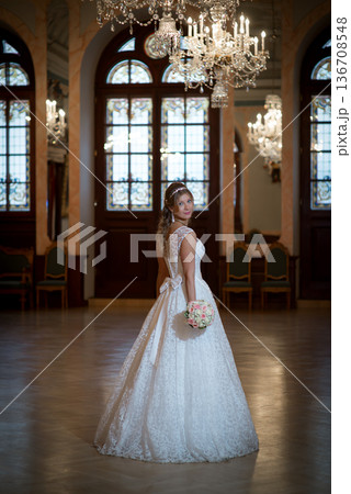 Romantic Bridal Portrait Beneath Crystal Chandeliers Romantic Bridal Portrait Beneath Crystal Chandeliers 136708548