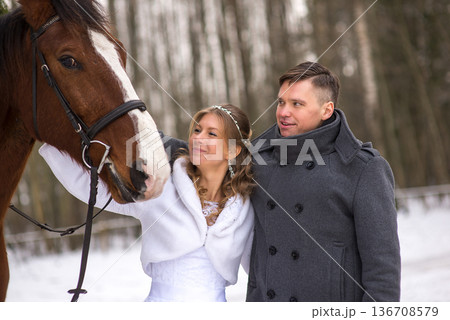 Romantic Winter Wedding Moment With Horse 136708579
