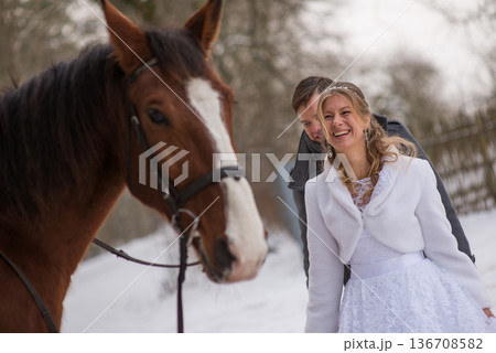 Laughing Bride With Horse During Winter Wedding Laughing Bride With Horse During Winter Wedding 136708582