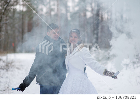 Bride Smiling Through Winter Smoke During Outdoor Wedding Bride Smiling Through Winter Smoke During Outdoor Wedding 136708823