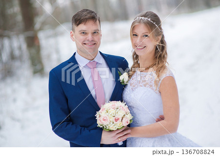 Wedding Couple Portrait In Snowy Forest Setting Wedding Couple Portrait In Snowy Forest Setting 136708824