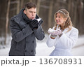 Groom Blowing Snow While Bride Smiles Happily 136708931